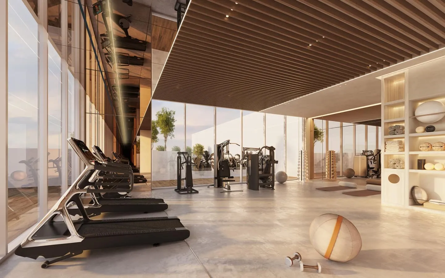 The gym, treadmills in a row under a slatted timber ceiling with glass along the far wall