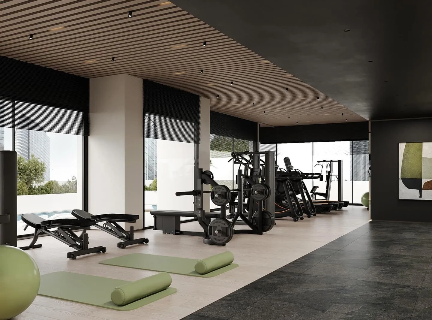 The gym's weights area with a bench and rack, glazing open to an outdoor training deck