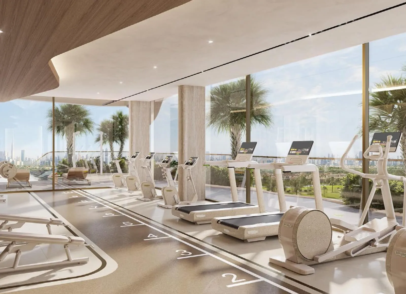 A gym behind full-height glass, treadmills in a row and a marked sprint track on the floor