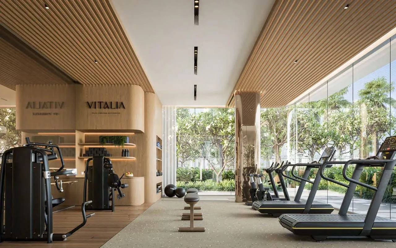 The gym under a slatted timber ceiling, the project name on the end wall