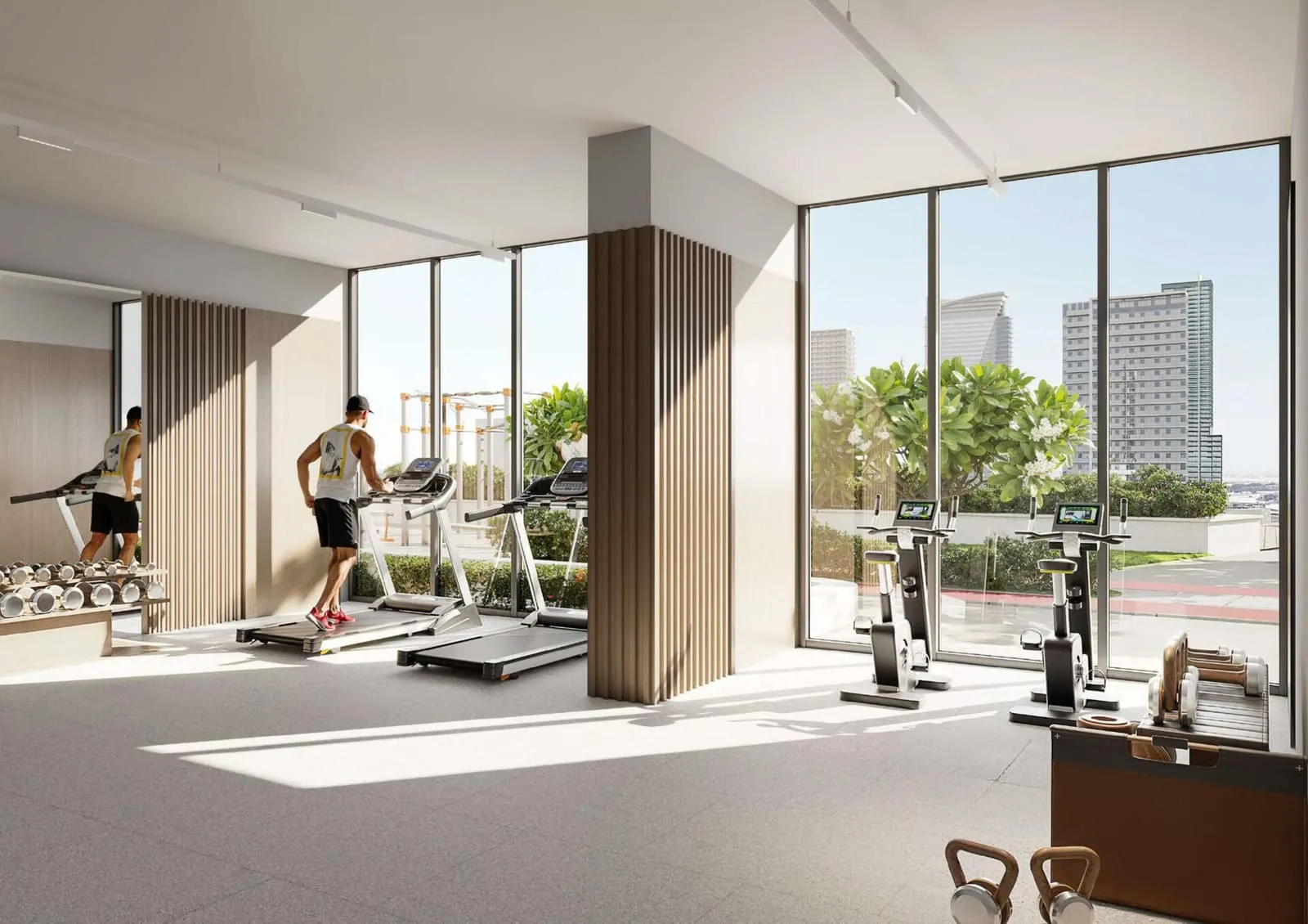 The indoor gym, treadmills lined along a full-height window