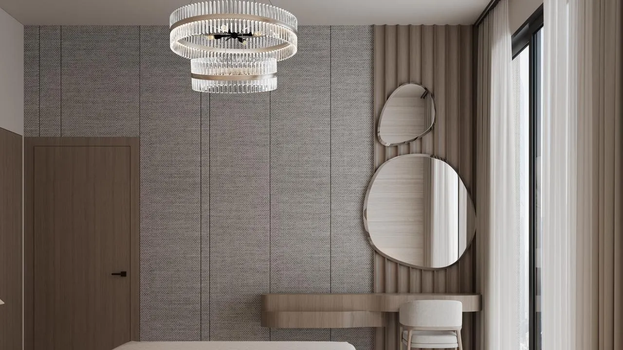 An entry hall, two organic shaped mirrors above a console table and full height wardrobe doors along the opposite wall