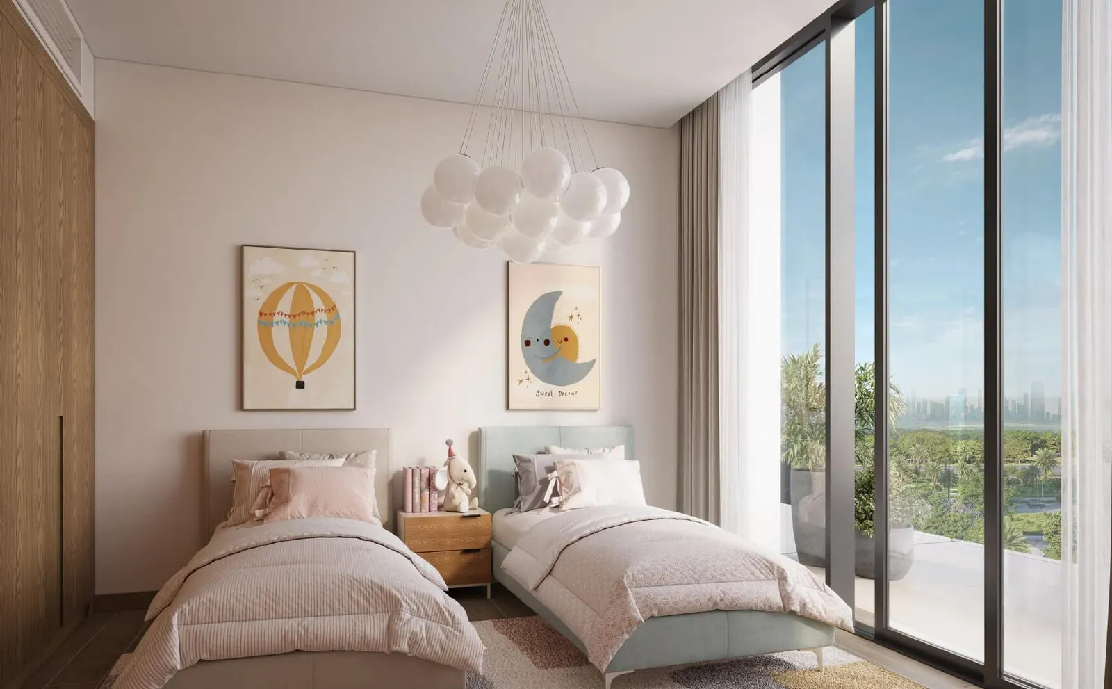 A children's bedroom with two beds, balloon prints above them and a window onto the surrounding greenery