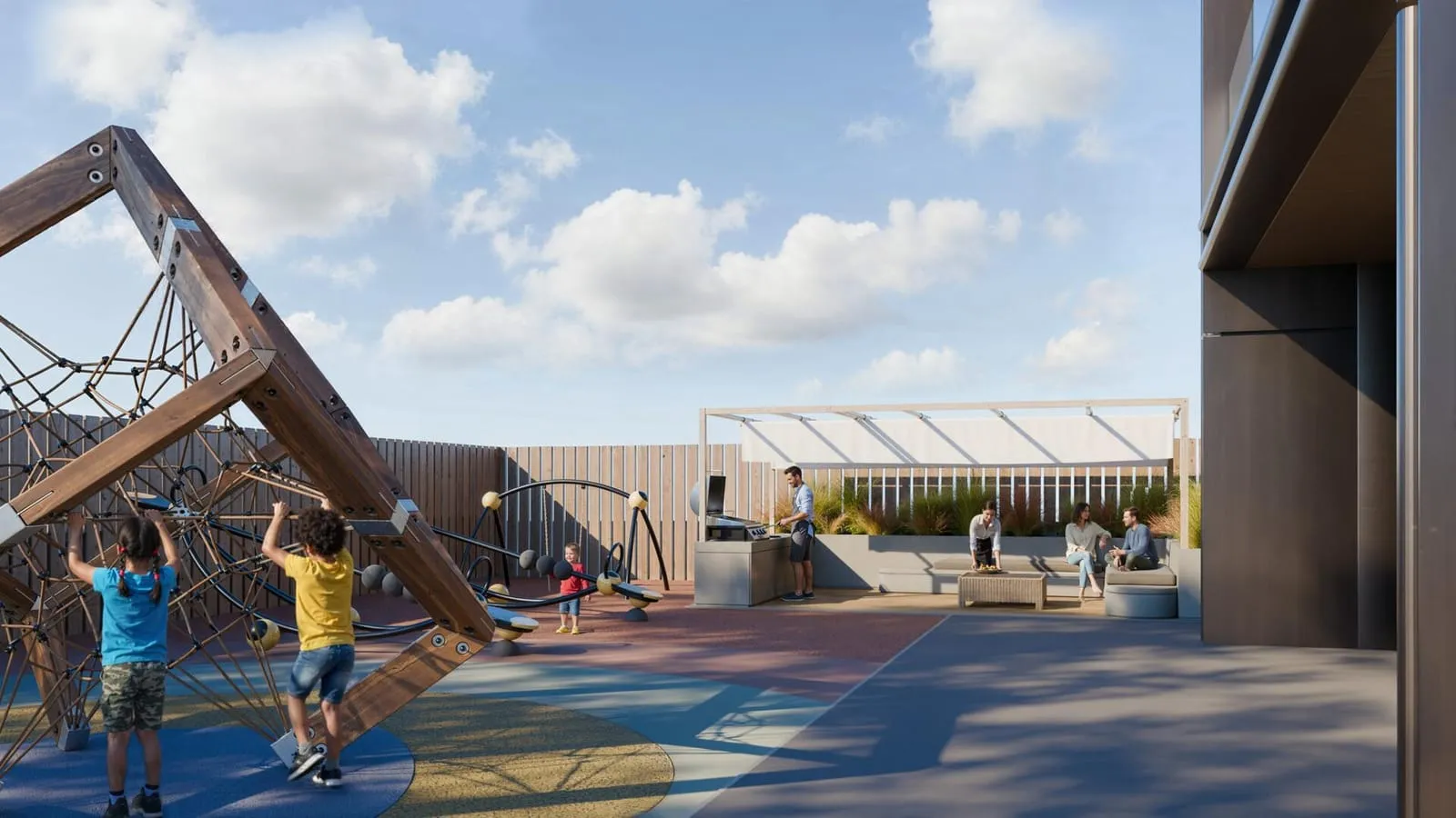A colourful children's play area with climbing frames within the community grounds.