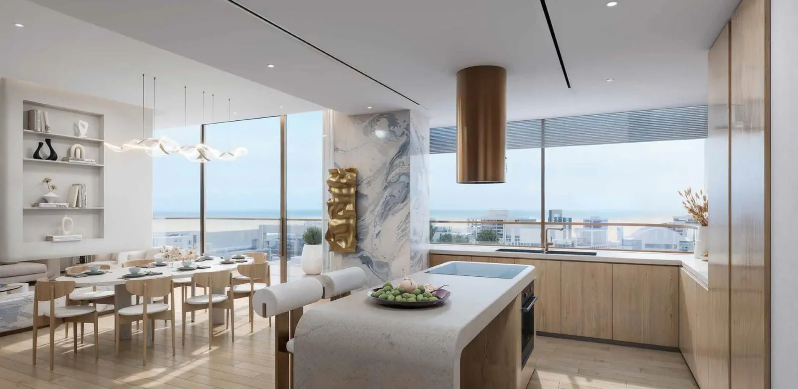 The open plan kitchen and dining area, a timber island under a pendant with the table beside the glazing