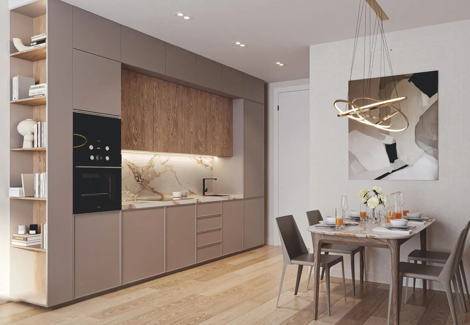 A kitchen open to the dining table, a marble splashback and an oven built into pale cabinetry