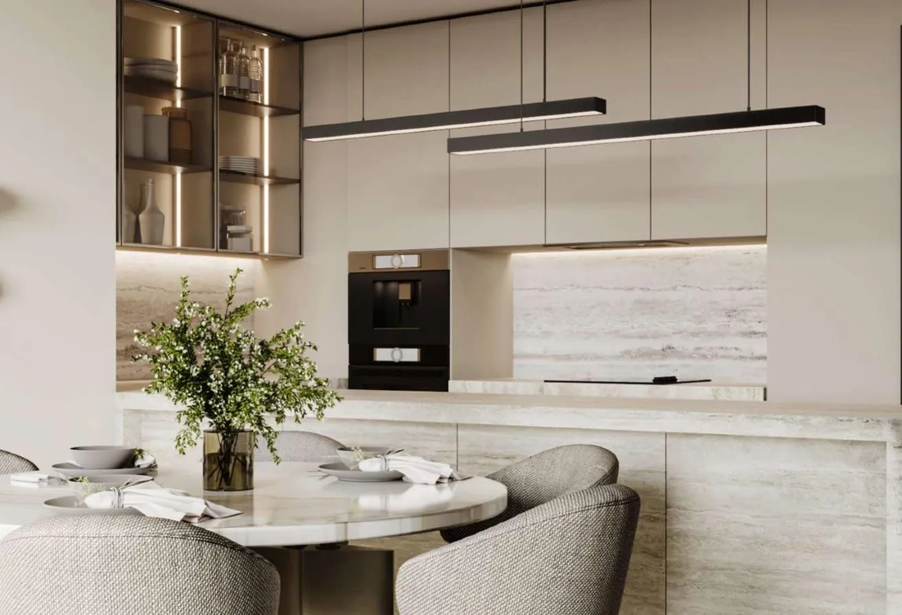Render of the kitchen with built-in ovens and a round dining table