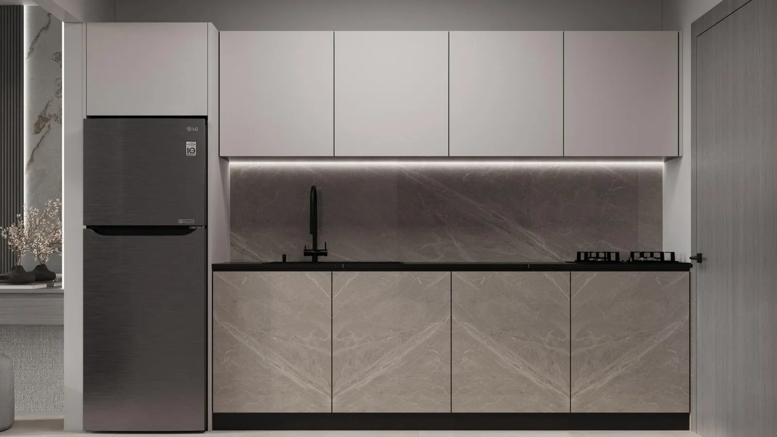 The kitchen in the grey finish, a run of pale upper cabinets over a black worktop with a freestanding fridge at the end