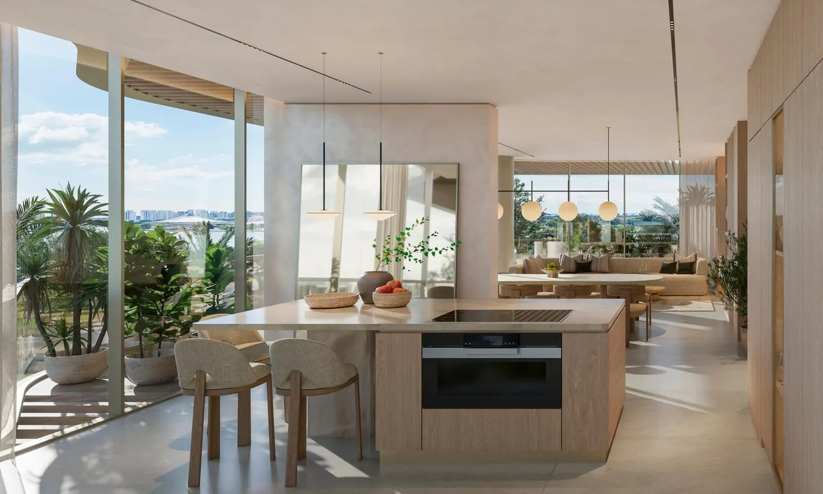 A kitchen island with a built-in oven, the dining table and full-height windows beyond