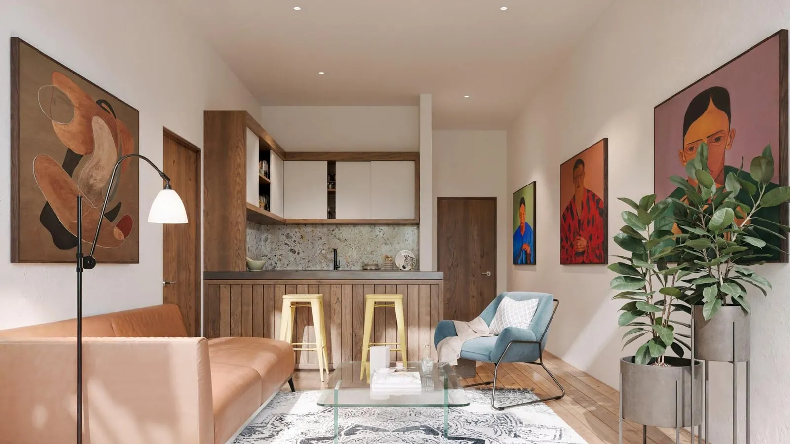 An open-plan kitchen and living area with a breakfast bar and gallery-style wall art.