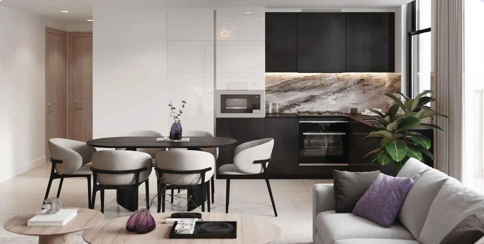 A semi-closed kitchen opening onto the living room, dark cabinetry against stone