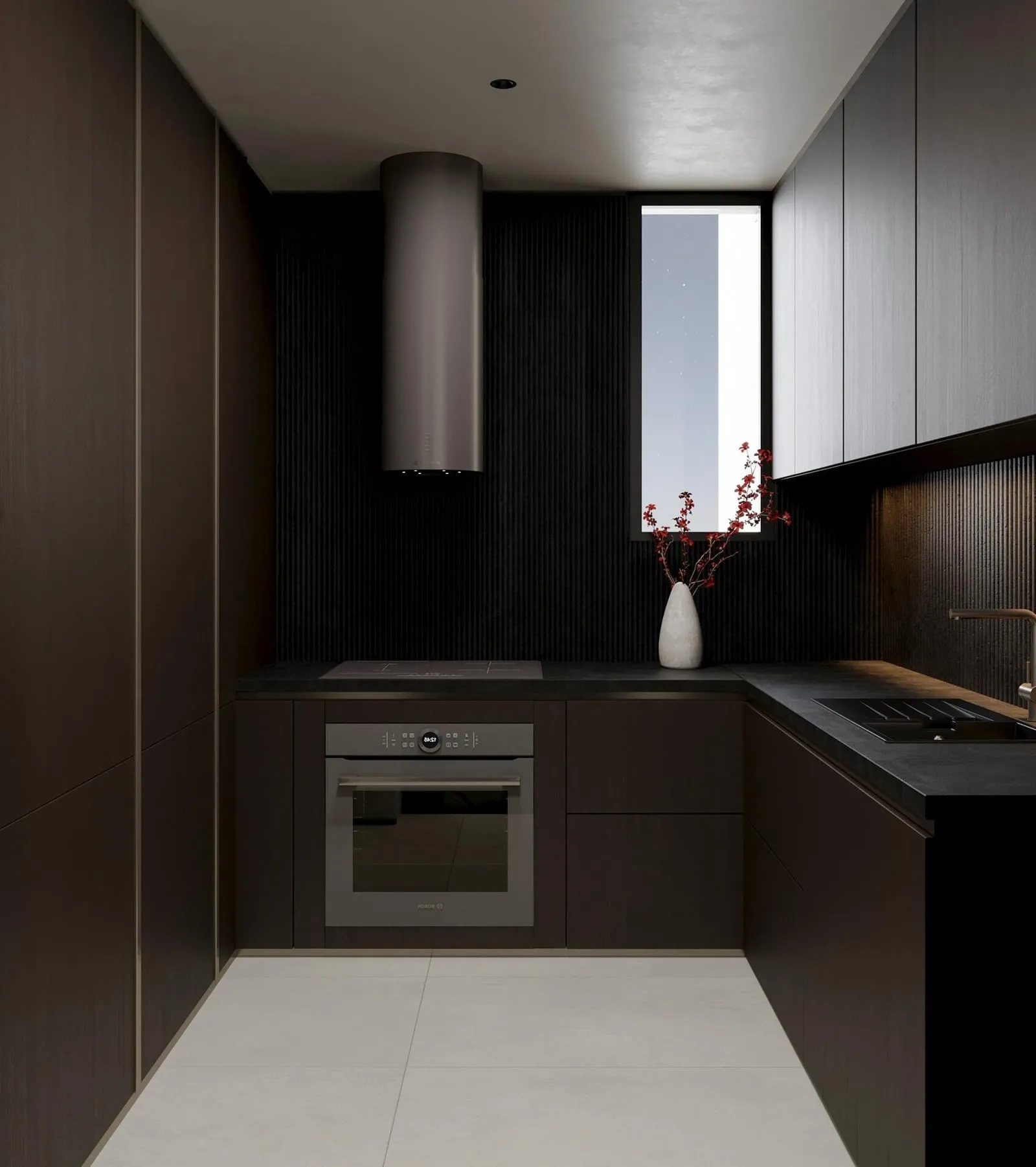 A kitchen in dark cabinetry with a built-in oven beneath a narrow window