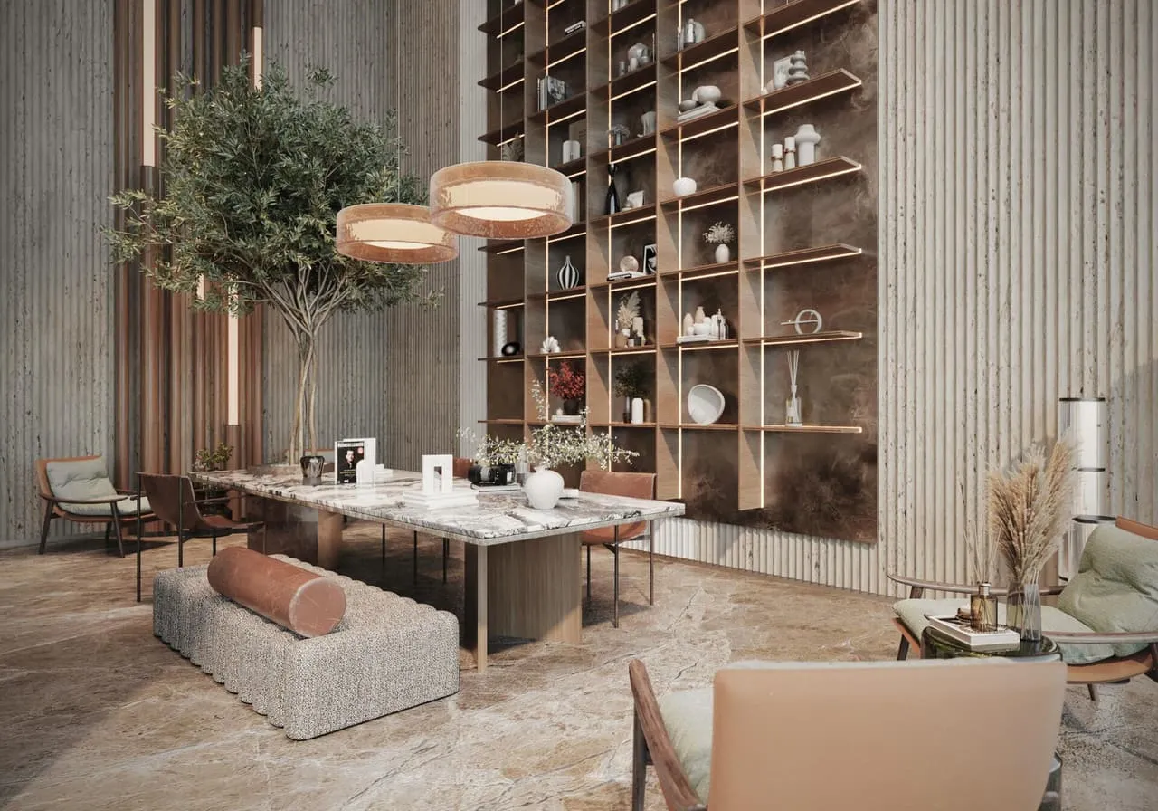 The library end of the lounge, shelves rising the full height of the room under wide ring pendants