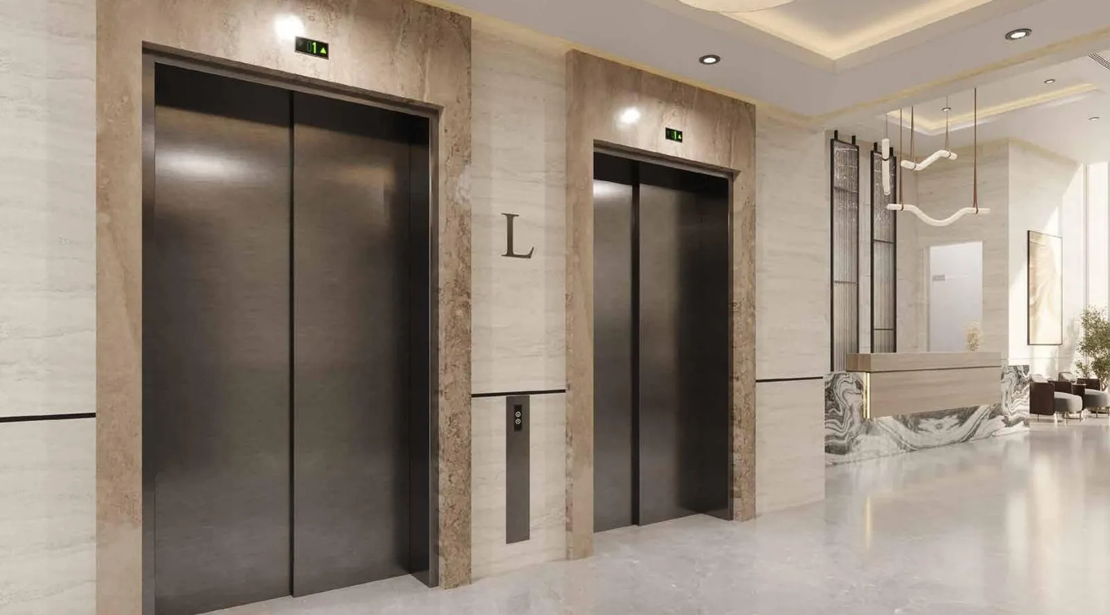 The lift lobby, two brushed metal lift doors set into stone cladding under a pendant light