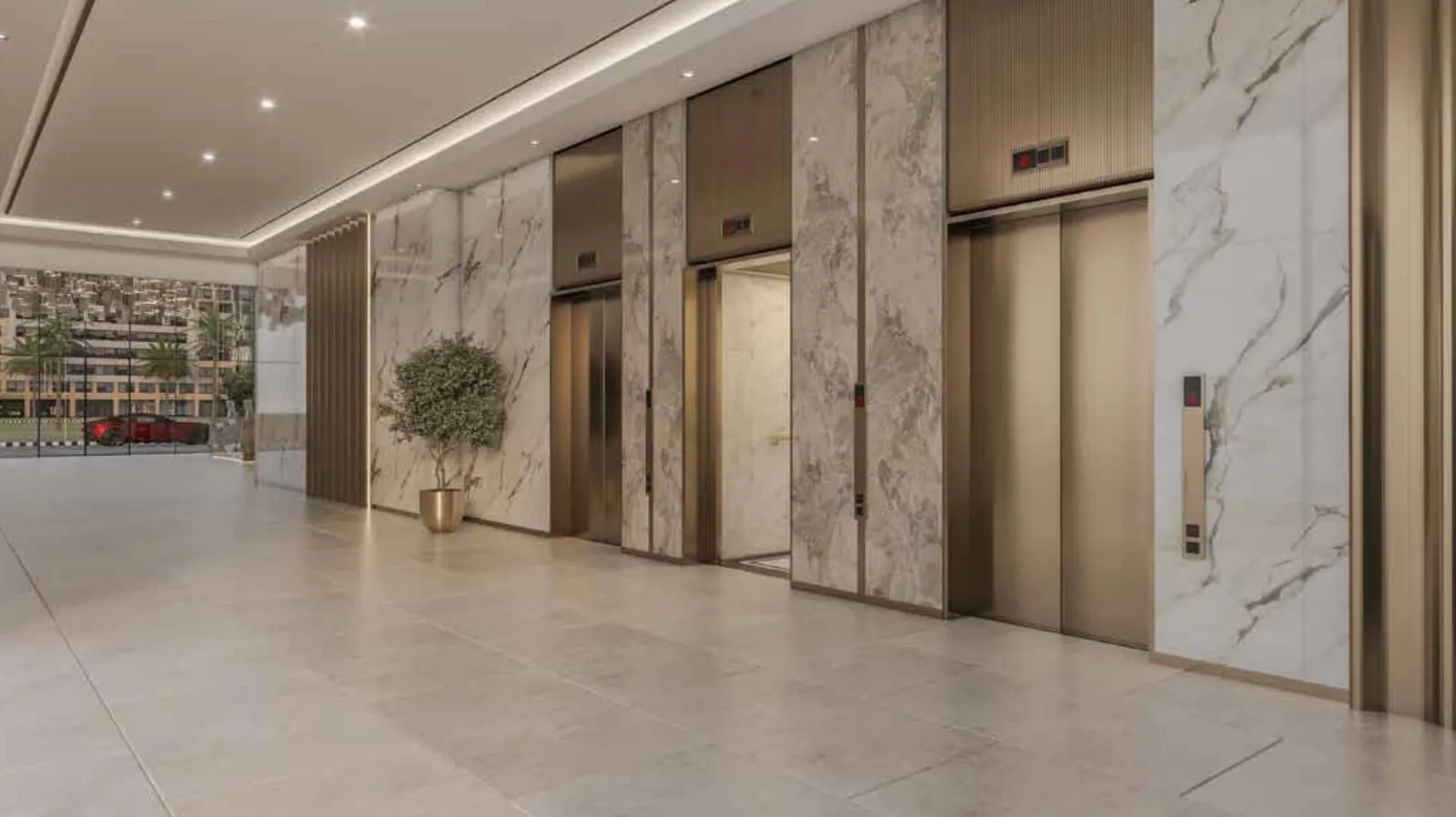 The lift lobby, marble-clad walls and planting either side of the doors on a polished stone floor