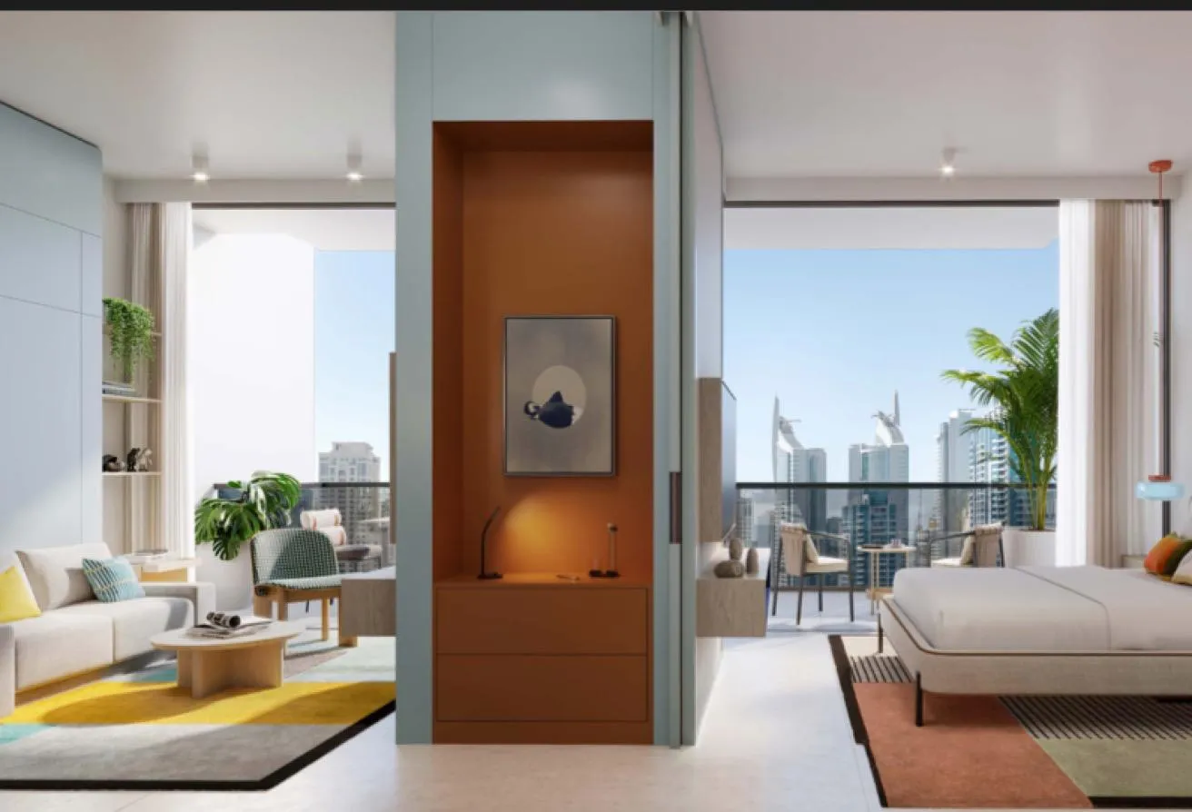 Render of the living area and bedroom opening onto a balcony, with towers beyond