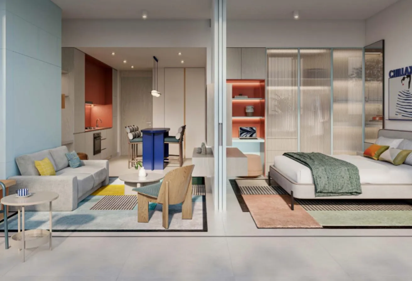 Render of an open-plan living area with a sofa, and a bedroom behind a glass partition