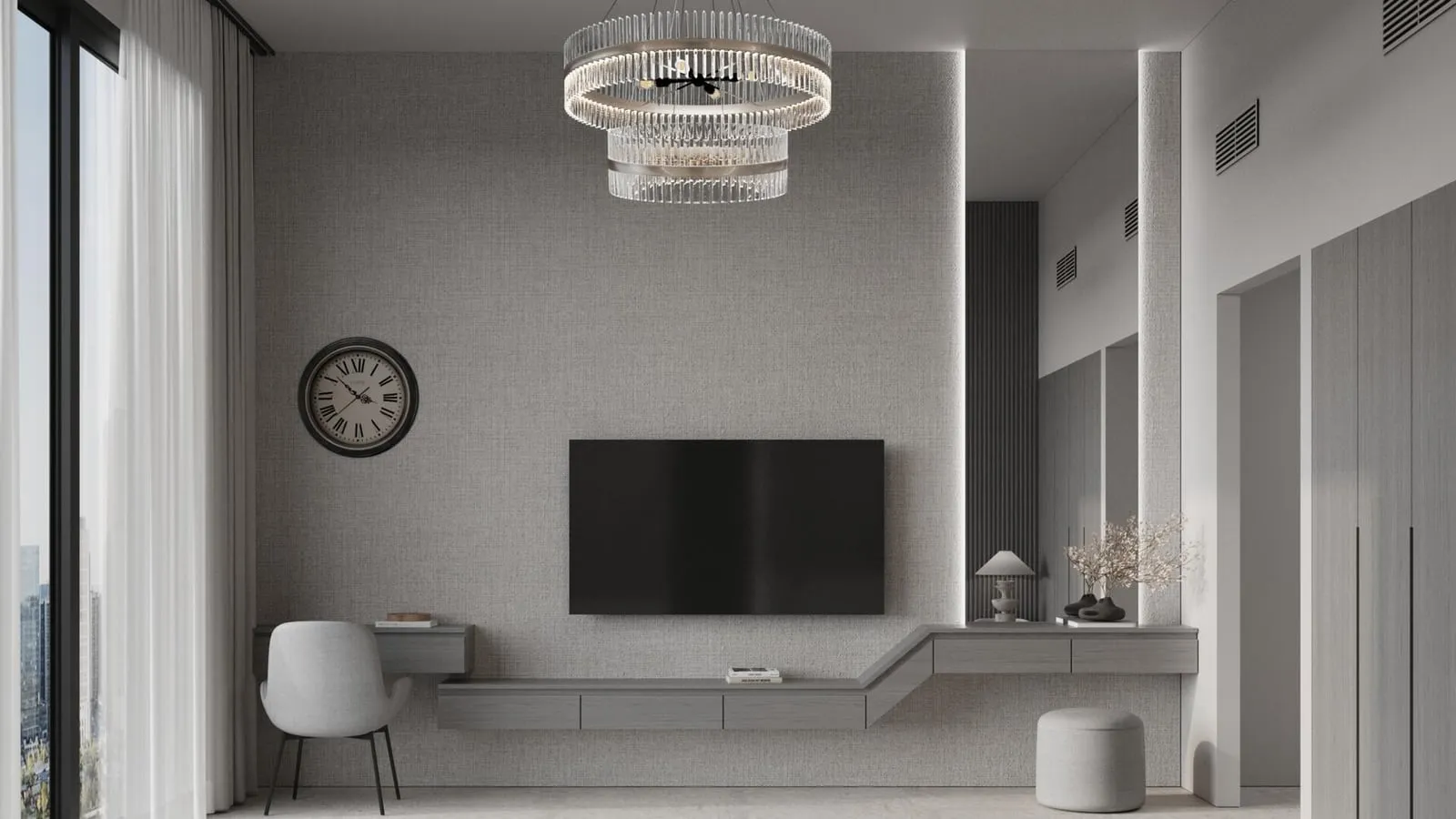 A living area facing a screen above a long floating console, a wall clock beside it and sheer curtains at the window