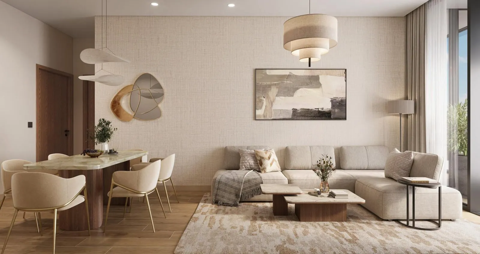 An open-plan living and dining room, the sofa facing a round dining table under a drum pendant