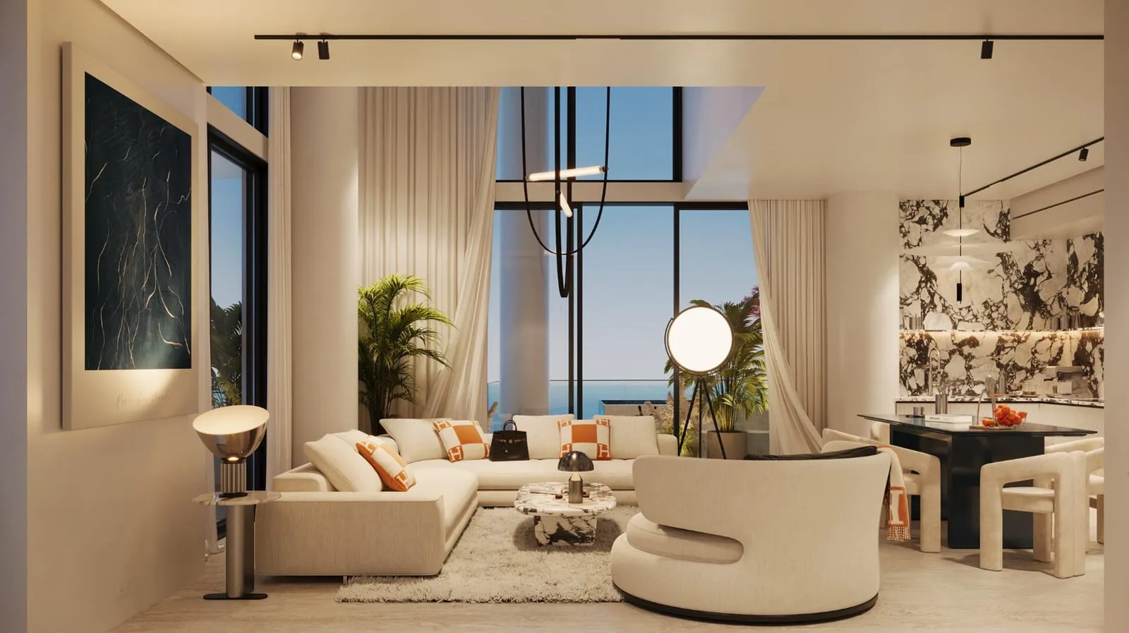 The living room seen from the sea-view windows, a globe lamp beside the sofa and the dining table and marble kitchen beyond