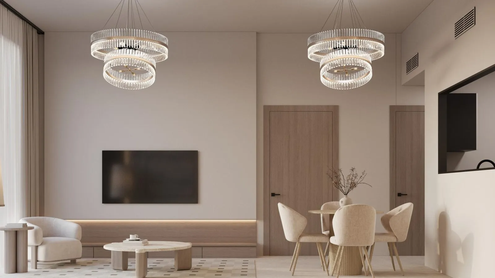 A living and dining room, a wall-mounted screen on a pale panel and a round table with four cream chairs