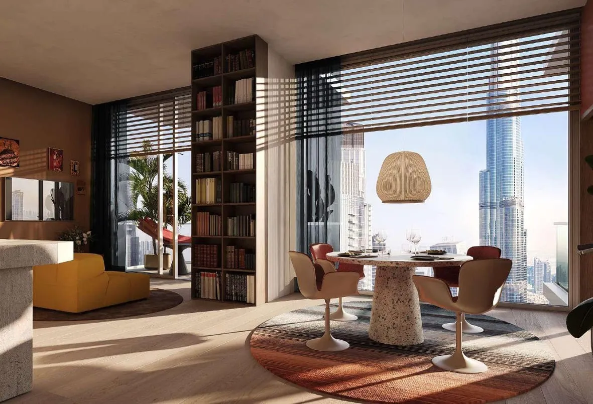 Render of a living and dining area with a round table and the Burj Khalifa through the window