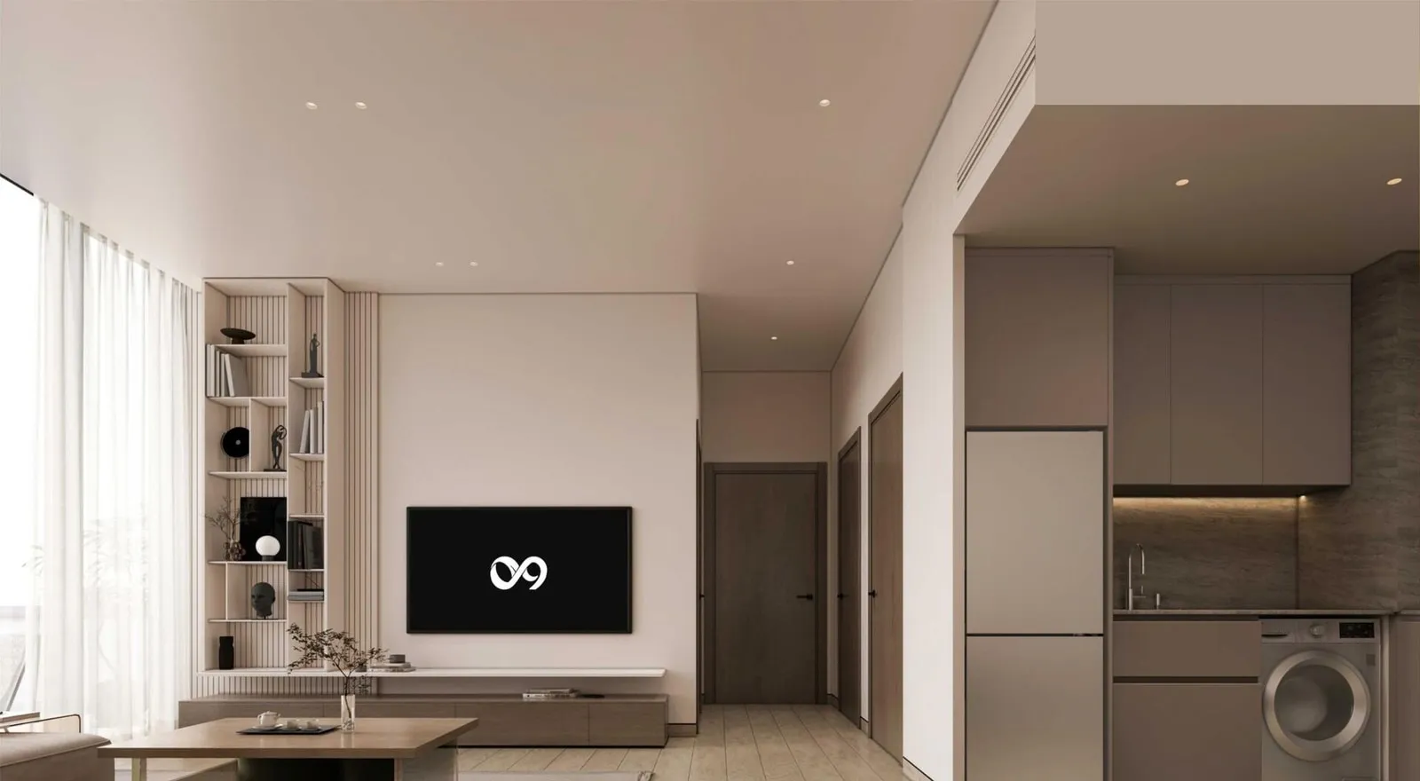 An open-plan living area with a wall-mounted television and the kitchen with its integrated laundry beyond