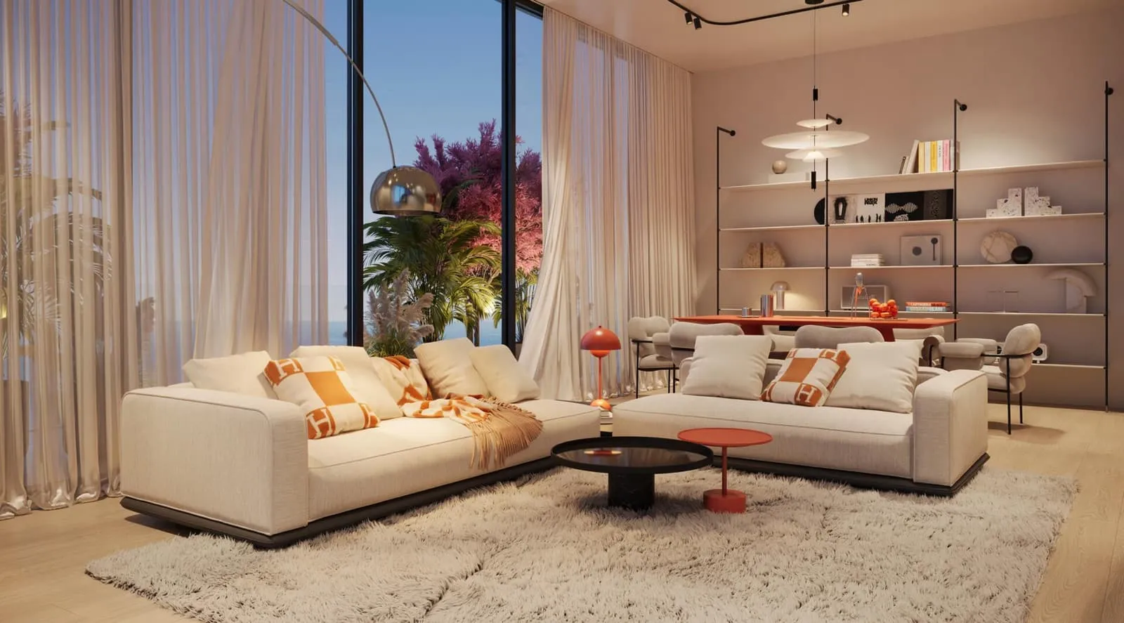 A living room with a pale corner sofa and planting, daylight flooding in through the glazing