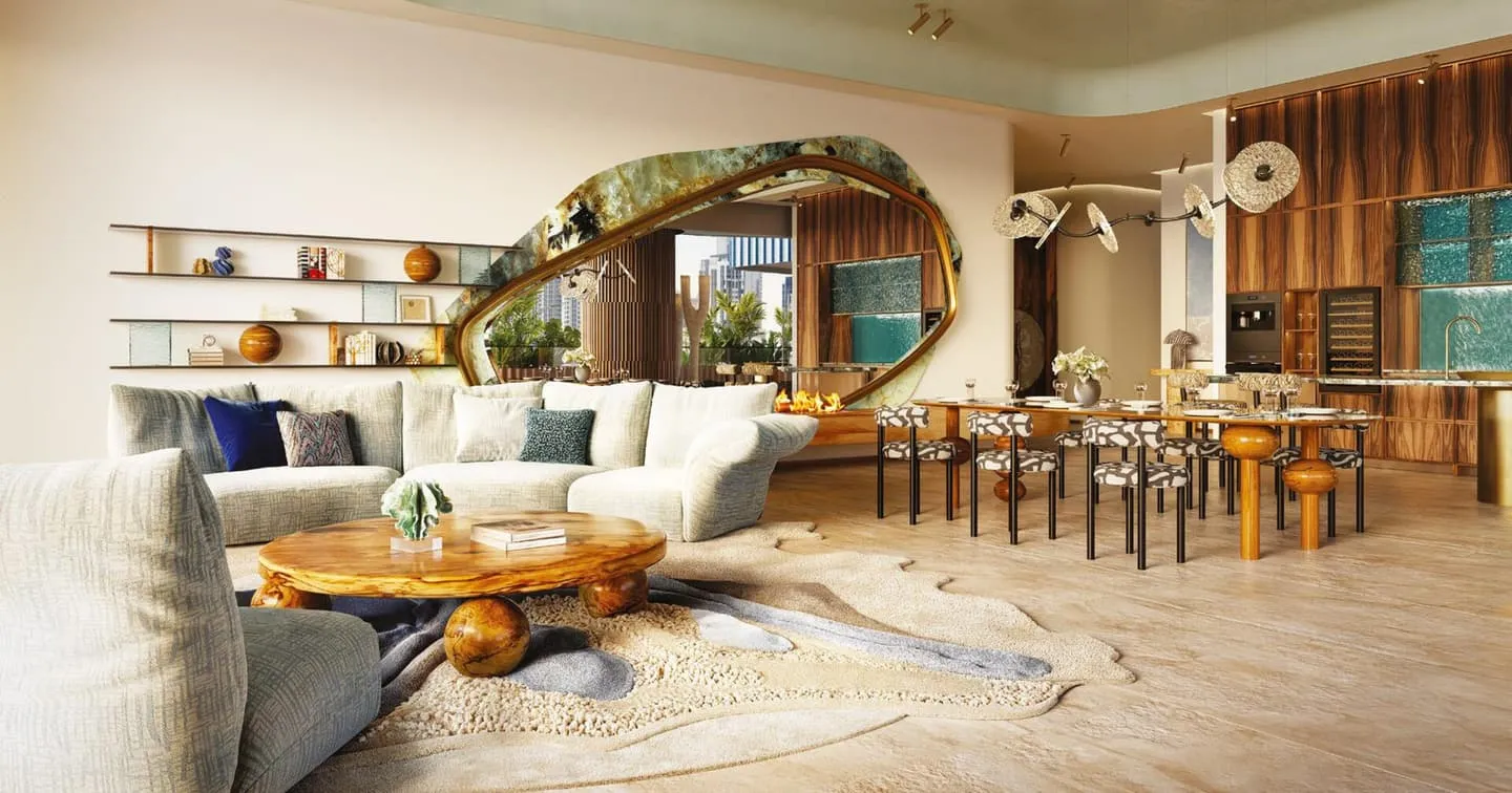 A living room with a curved white sofa around a low timber table, a wave-shaped mirror on the wall behind