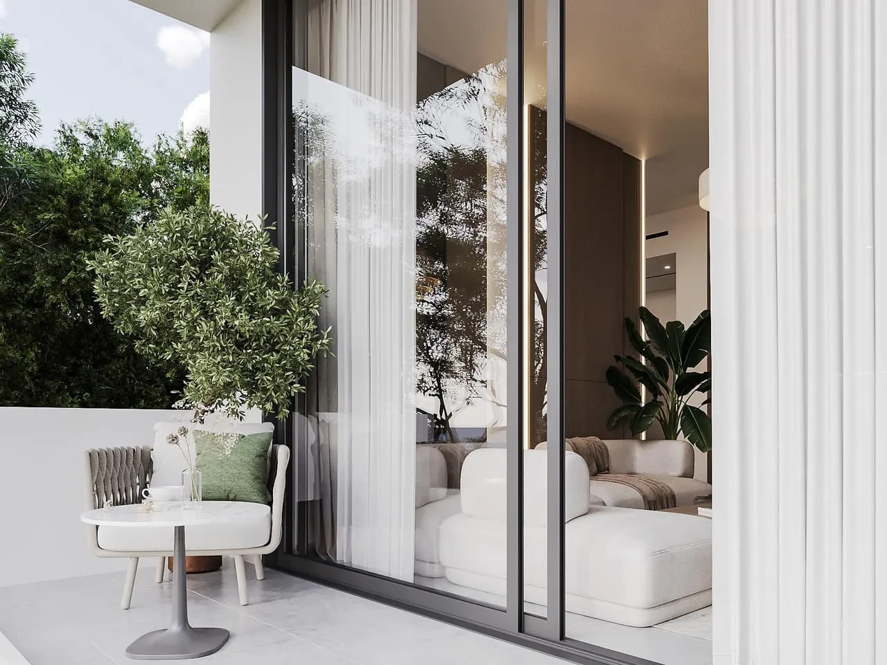 A living room opening to the garden, sheer curtains drawn back from full height glass