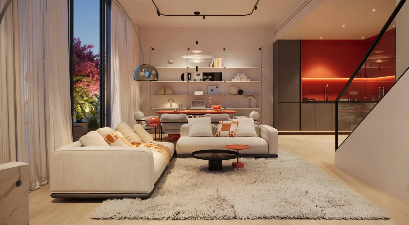 A living room with a deep sofa and curtained glazing, the red-lit kitchen visible beyond