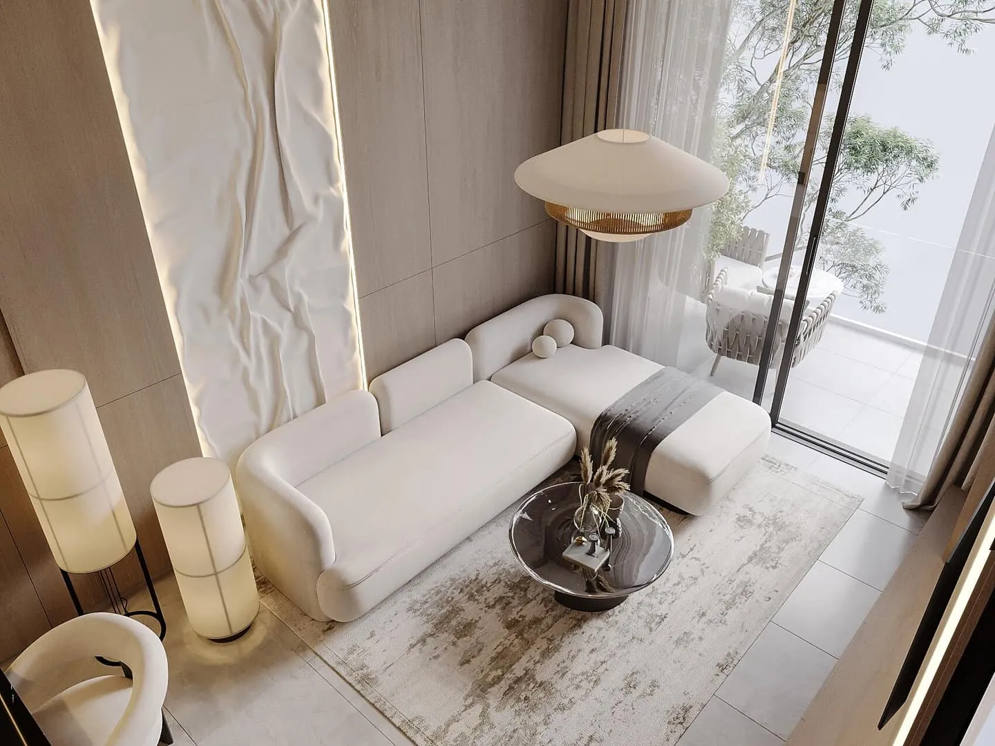 A seating area against a veined marble wall, a bronze side table and a long low sofa