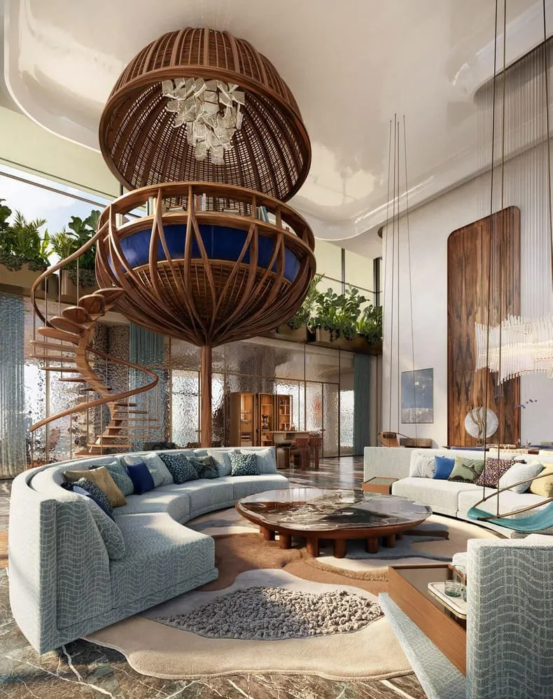 A woven rattan sphere hangs above the sofas in a double height living room, a timber stair climbing at one side