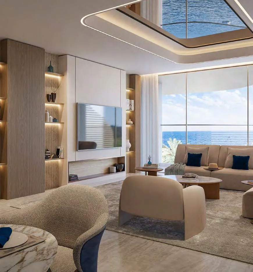 A living room turned to the sea, the television set into pale joinery