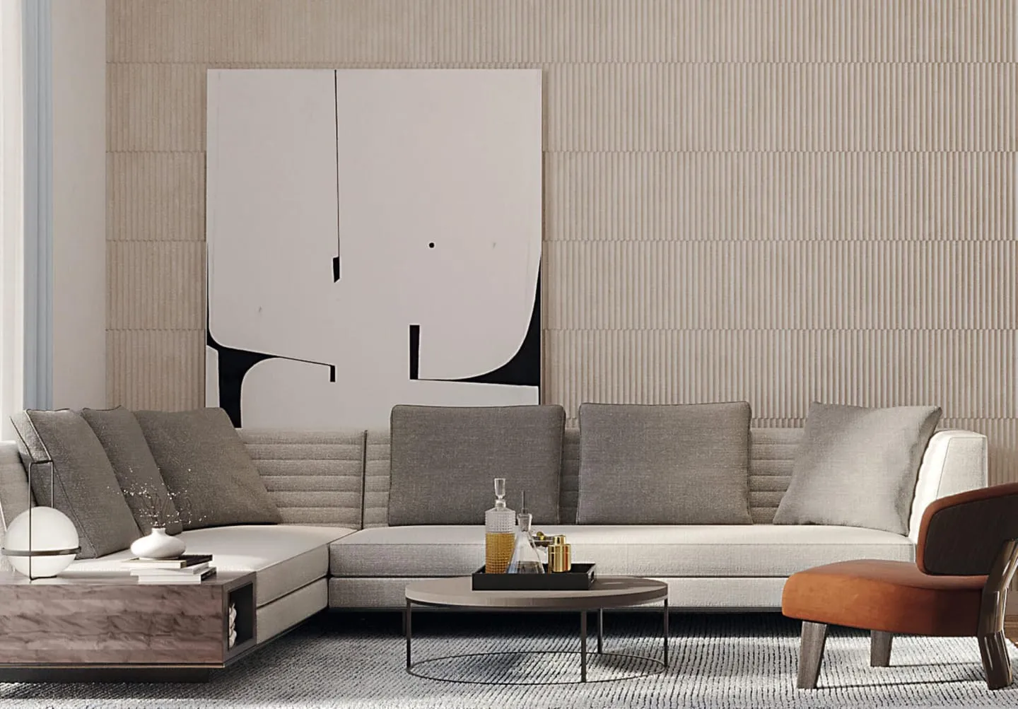 A living room with a grey sectional sofa, a leather armchair and a large canvas on the fluted wall