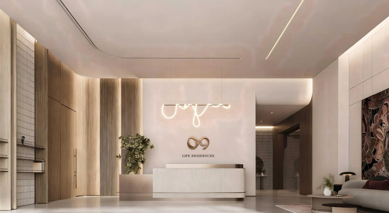 A lobby lounge with seating arranged in front of the backlit logo wall