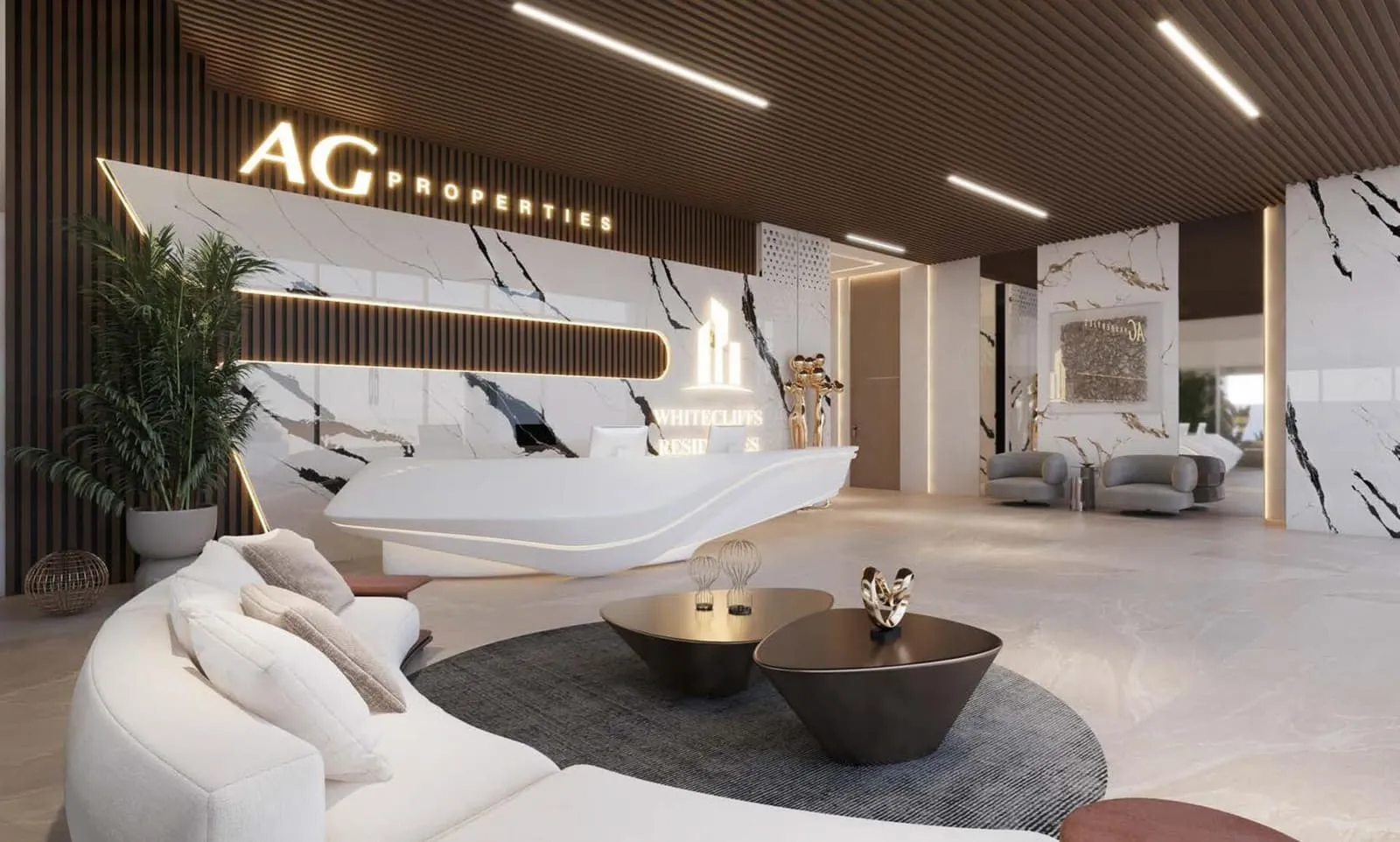 Building lobby lounge with a white sofa and the Ag Properties monogram on the wall