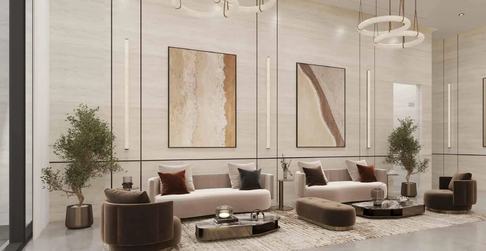 The lobby lounge, armchairs and sofas beneath ring pendants with artwork on the panelled wall