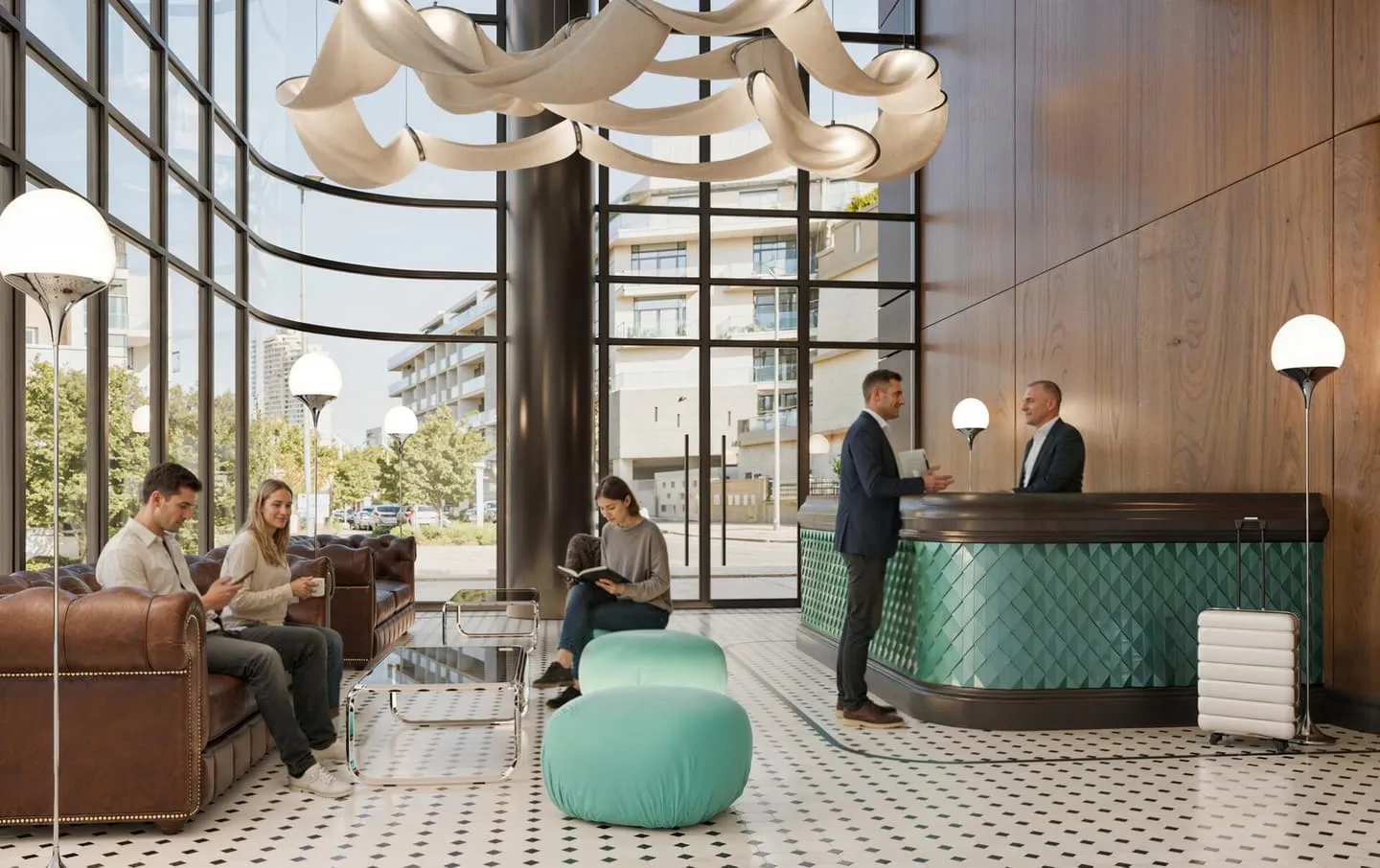 A welcoming lobby and reception area finished with teal seating and warm lighting.