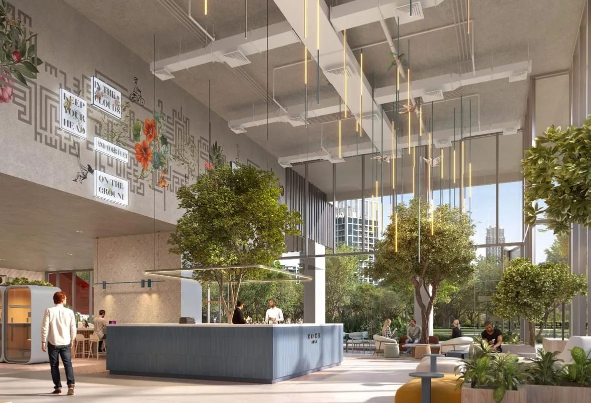 Render of the double-height lobby, with trees and a reception desk
