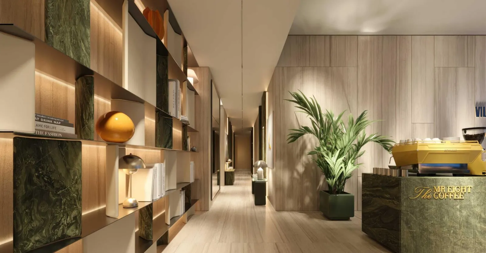 The lobby's reception counter in green stone, with display shelving and a large plant beside it