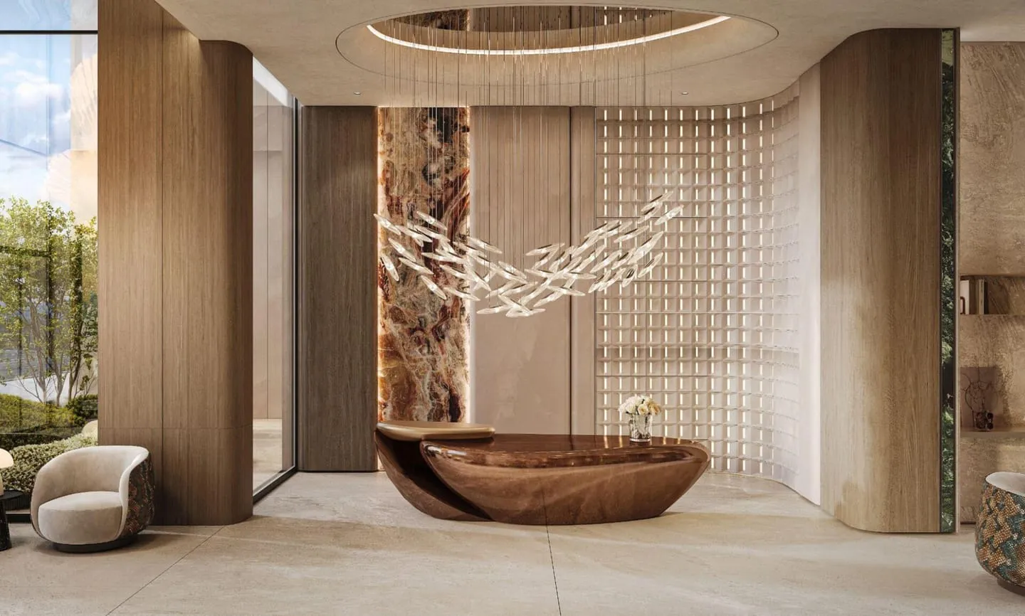 A reception area with a suspended net sculpture over seating near the wood desk