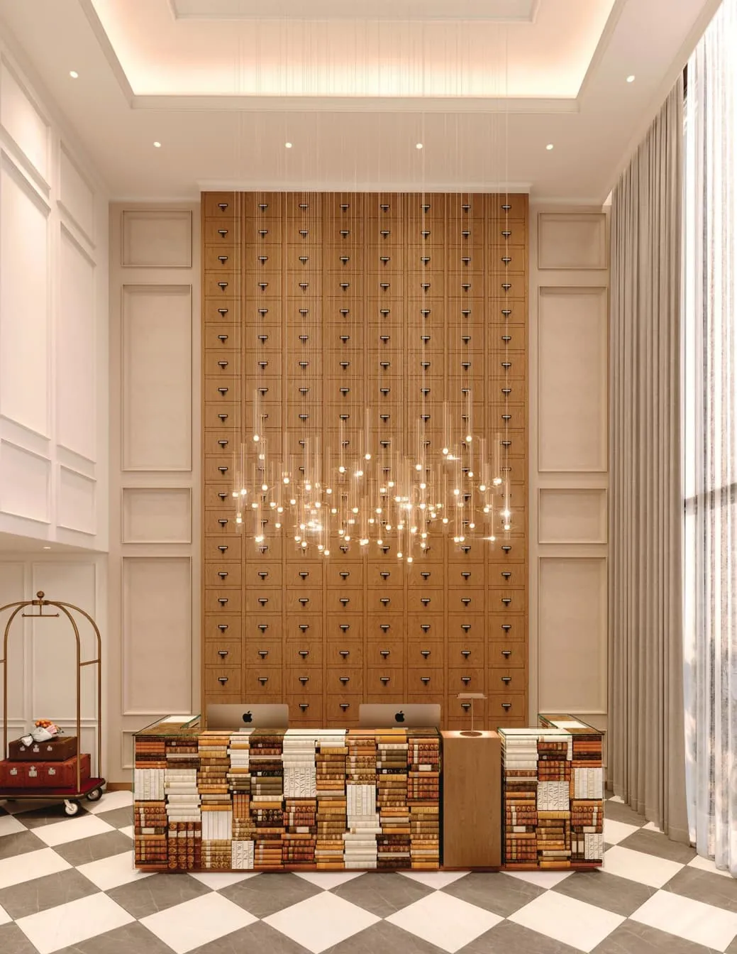 The lobby, a reception desk faced in books under a wall of card-catalogue drawers and a chandelier of hanging lights