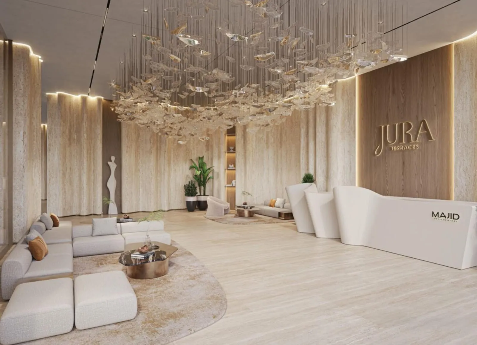 The lobby under a chandelier of glass leaves, the project's name in brass on a travertine wall and the developer's name on the reception desk
