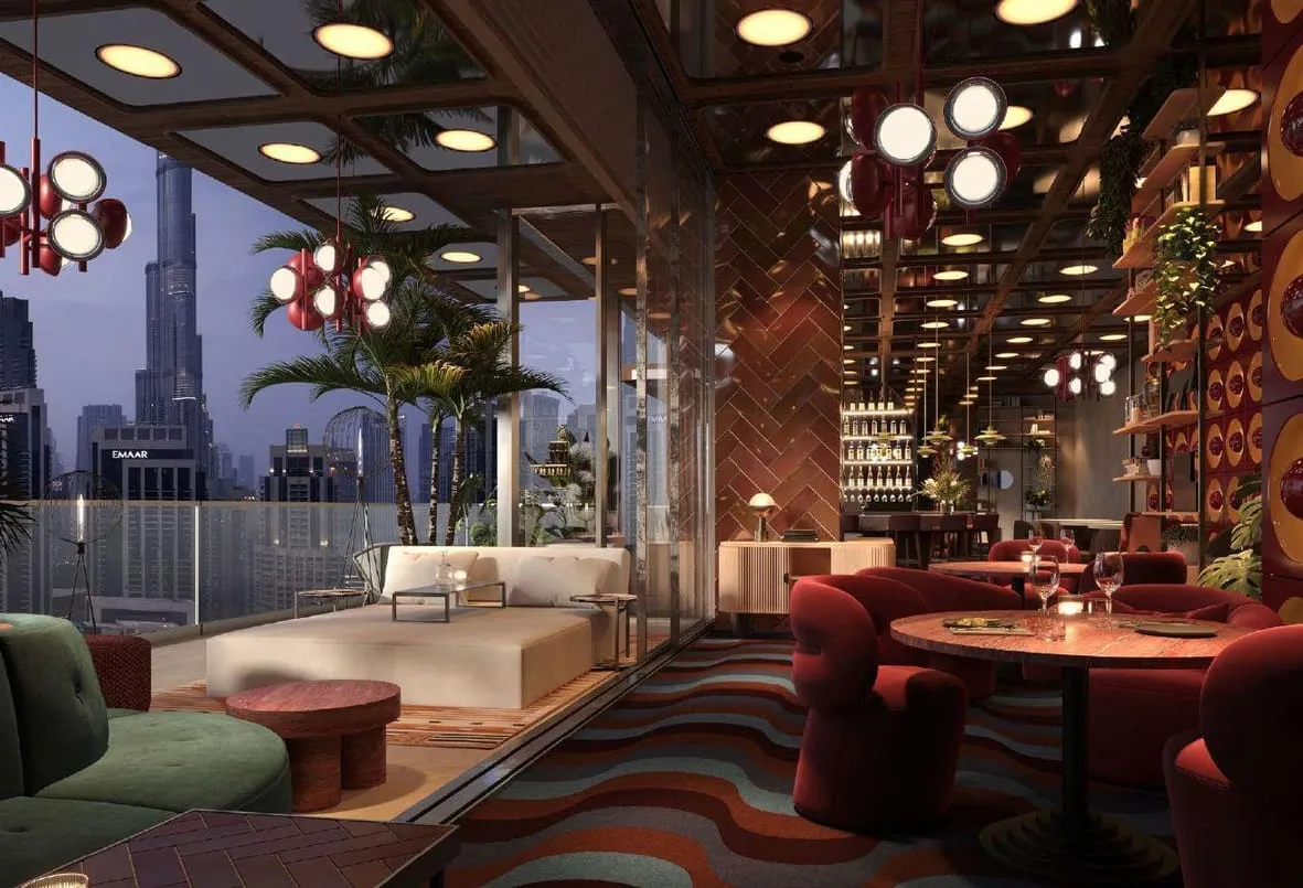 Render of a lounge with red velvet chairs and the Burj Khalifa through the glass