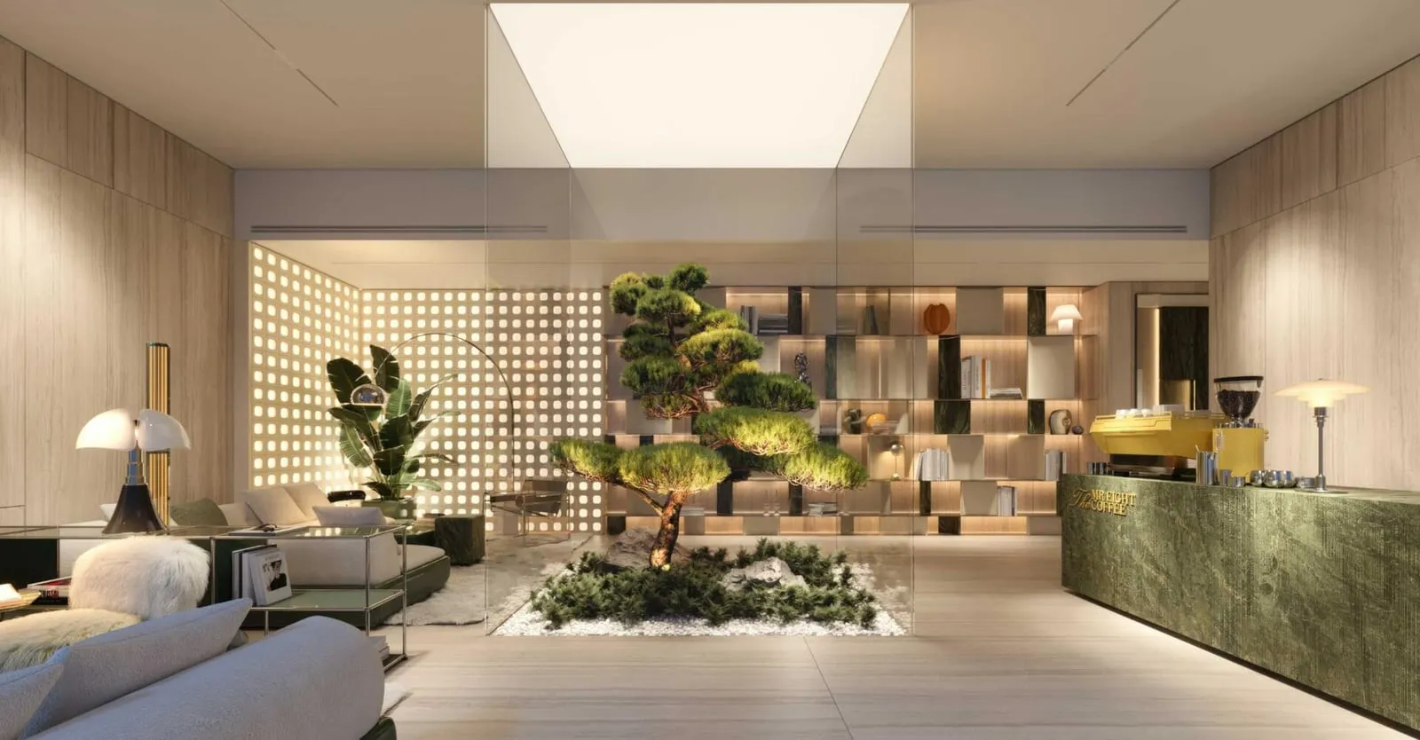 A residents' lounge behind a perforated screen wall, with planting and a green stone counter