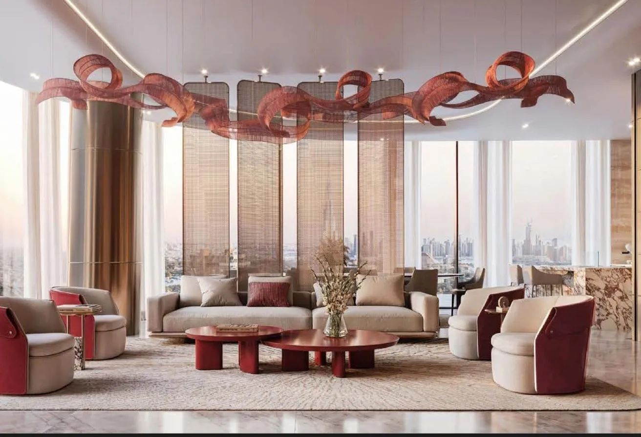 Render of a lounge with armchairs and sofas beneath a red ribbon sculpture