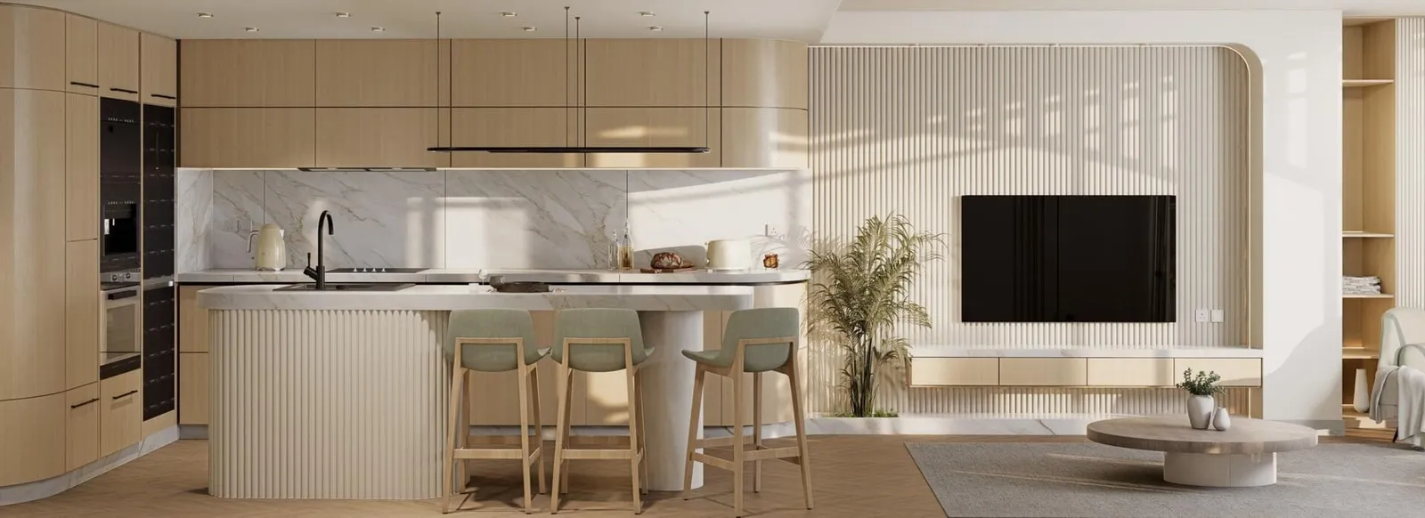 An open-plan kitchen with a breakfast bar flowing into the adjoining living area
