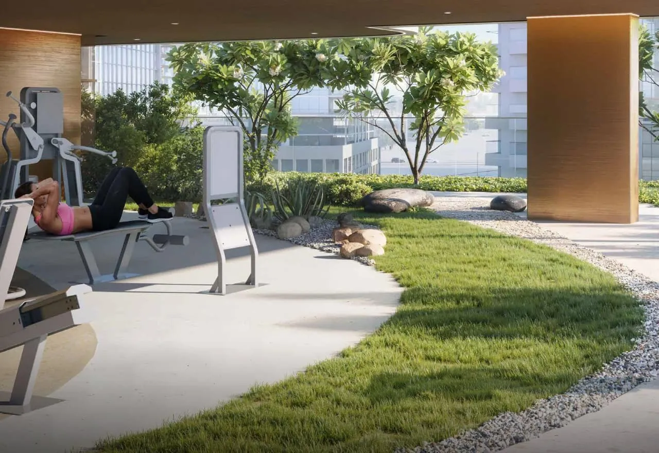 Outdoor gym equipment set on the lawn, trees for shade and the neighbouring blocks beyond