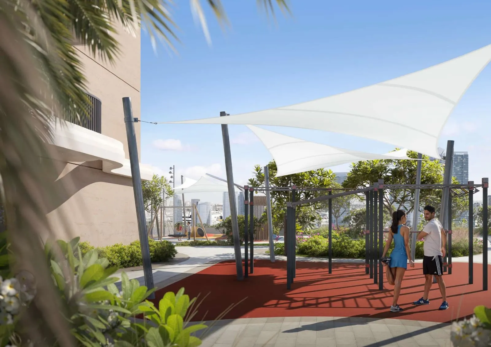 An outdoor training area under sail canopies, planting between the equipment